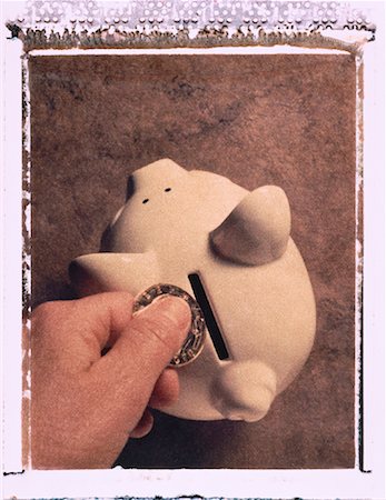 simsearch:700-00045425,k - Hand Putting Coin in Piggy Bank Stock Photo - Rights-Managed, Code: 700-00043421