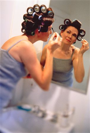 Woman Applying Make-Up in Mirror Stock Photo - Rights-Managed, Code: 700-00043518