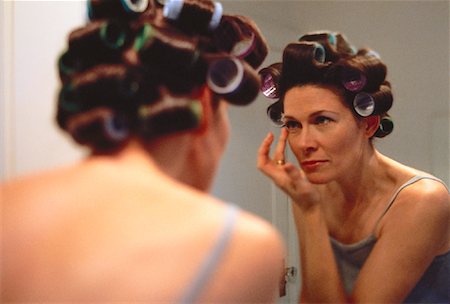 Woman Looking in Mirror Stock Photo - Rights-Managed, Code: 700-00043520