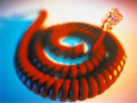 Close-Up of Coiled Telephone Cord And Plug Stock Photo - Rights-Managed, Code: 700-00043879