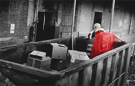 Woman in Dress, Climbing Out of Dumpster Foto de stock - Con derechos protegidos, Código: 700-00043960