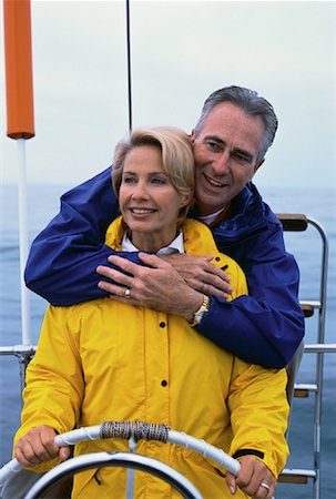 simsearch:600-00948212,k - Mature Couple at Steering Wheel Of Boat, Lake Ontario, Canada Stock Photo - Rights-Managed, Code: 700-00054280