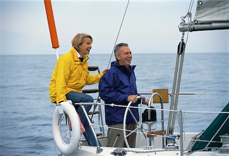 simsearch:700-00031157,k - Mature Couple at Steering Wheel Of Boat, Lake Ontario, Canada Stock Photo - Rights-Managed, Code: 700-00054281
