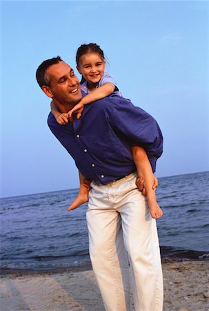 piggyback daughter at beach - Father Giving Daughter Piggy Back Ride on Beach Stock Photo - Rights-Managed, Code: 700-00054525