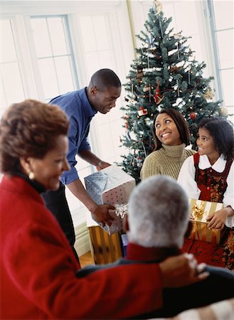 pictures of black family celebrating christmas - Family Gathered near Christmas Tree Stock Photo - Rights-Managed, Code: 700-00055077