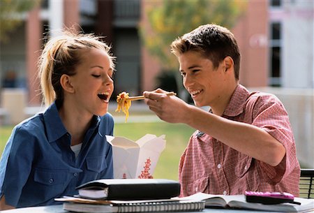 david schmidt education - Teenage Couple Eating Take-Out Food While Studying Outdoors Stock Photo - Rights-Managed, Code: 700-00055294