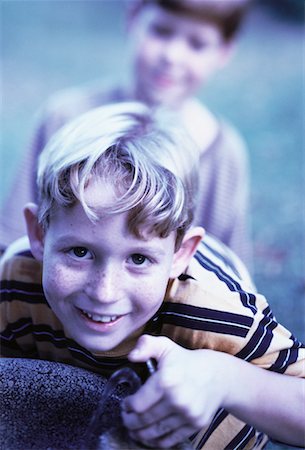 Portrait of Boy Drinking from Water Fountain Foto de stock - Con derechos protegidos, Código: 700-00055336