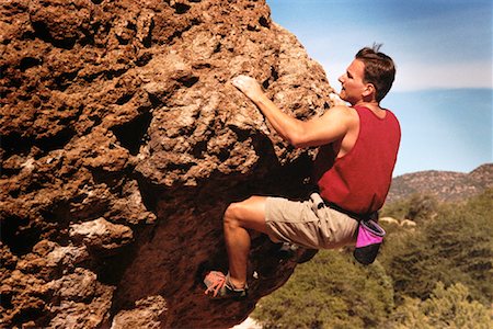 superar obstáculos - Man Rock Climbing Foto de stock - Con derechos protegidos, Código: 700-00055525