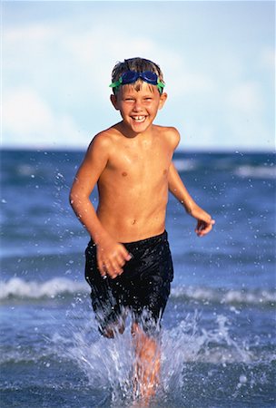 Boy in Swimwear, Running on Beach Stock Photo - Rights-Managed, Code: 700-00055540