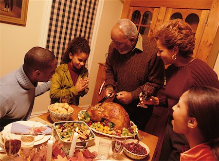 family praying at dinner - Grandfather Carving Turkey at Thanksgiving Dinner Table Stock Photo - Rights-Managed, Code: 700-00055598