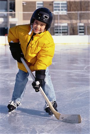 Portrait of Boy Playing Hockey At Outdoor Ice Rink Stock Photo - Rights-Managed, Code: 700-00055592