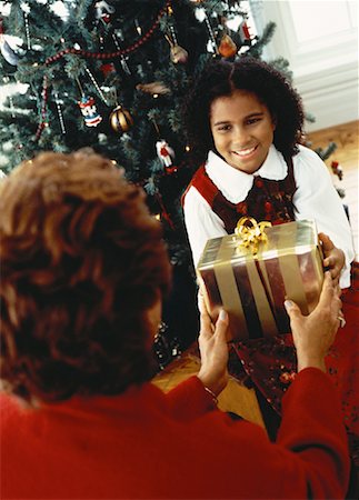 Grandmother Giving Christmas Gift to Granddaughter Stock Photo - Rights-Managed, Code: 700-00055668