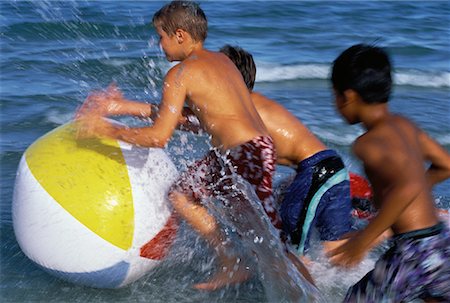 simsearch:700-00748015,k - Three Boys in Swimwear, Playing With Beach Ball in Water on Beach Stock Photo - Rights-Managed, Code: 700-00055867