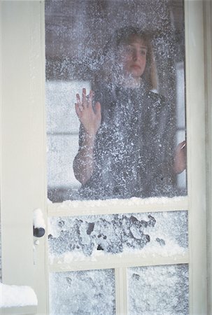 Teenage Girl Standing in Doorway With Frost on Screen Stock Photo - Rights-Managed, Code: 700-00056040