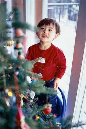 simsearch:700-00190297,k - Boy Standing near Christmas Tree Foto de stock - Con derechos protegidos, Código: 700-00056129