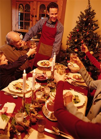 family eating light - Family Toasting with Wine Glasses At Christmas Dinner Table Stock Photo - Rights-Managed, Code: 700-00056145