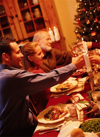 Family Toasting with Wine Glasses At Christmas Dinner Table Foto de stock - Con derechos protegidos, Código: 700-00056146