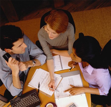 simsearch:700-00523788,k - Overhead View of Business People Working at Table Stock Photo - Rights-Managed, Code: 700-00056380