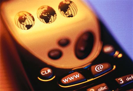 simsearch:700-00098020,k - Close-Up of Cell Phone with Three Globes on Screen and WWW and @ Symbol on Keys Stock Photo - Rights-Managed, Code: 700-00056470