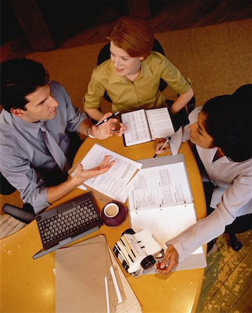 simsearch:700-00523788,k - Overhead View of Business People Working at Table Stock Photo - Rights-Managed, Code: 700-00056490