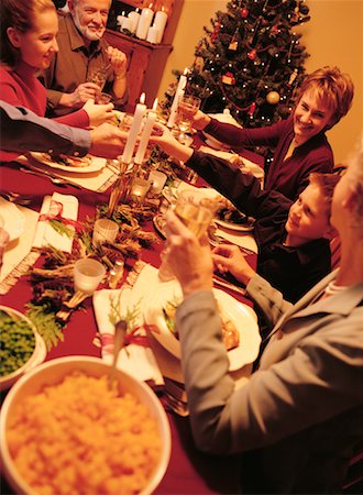 Family Toasting with Wine Glasses At Christmas Dinner Table Foto de stock - Con derechos protegidos, Código: 700-00057523