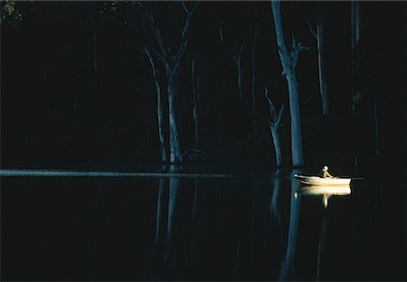 Row boat on night lake Stock Photos Page 1 Masterfile