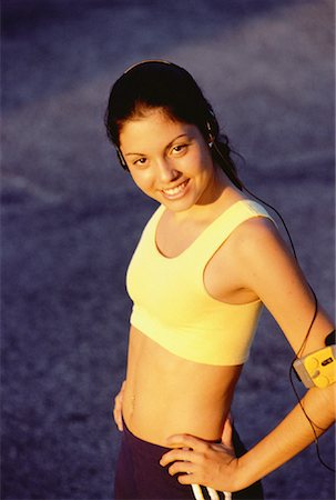 spandex sports girl - Portrait of Teenage Girl Using Personal Stereo Outdoors Stock Photo - Rights-Managed, Code: 700-00057734