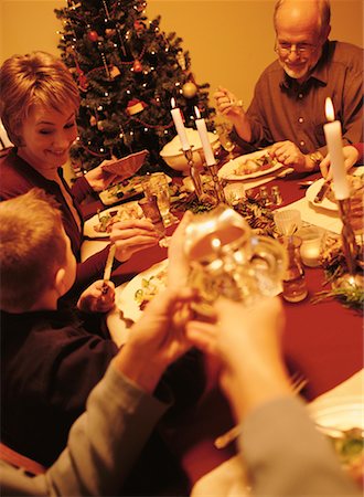 family eating light - Family Gathered at Table for Christmas Dinner Stock Photo - Rights-Managed, Code: 700-00057790