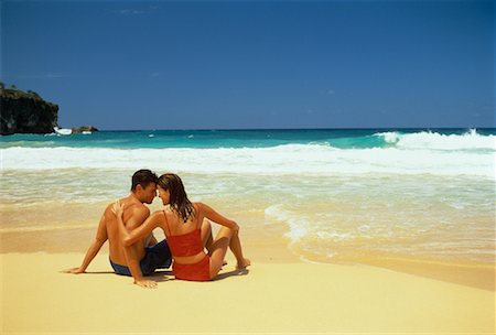 Back View of Couple in Swimwear Sitting on Beach Dominican Republic, Caribbean Foto de stock - Con derechos protegidos, Código: 700-00058121