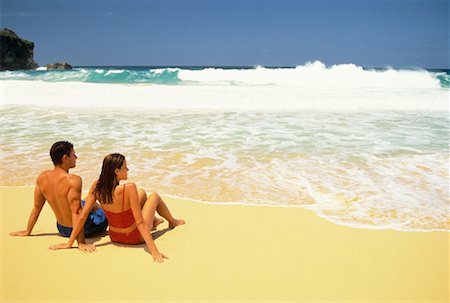 Back View of Couple in Swimwear Sitting on Beach Dominican Republic, Caribbean Foto de stock - Con derechos protegidos, Código: 700-00058277