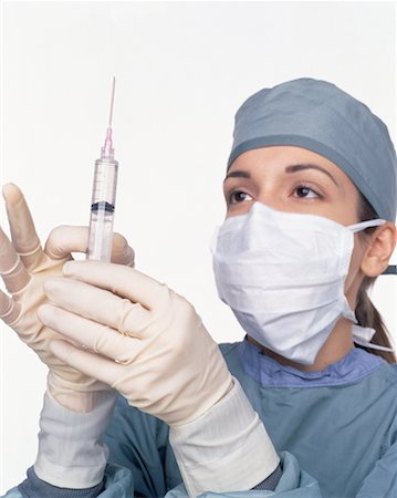 Female Surgeon Holding Syringe Stock Photo - Rights-Managed, Code: 700-00058314