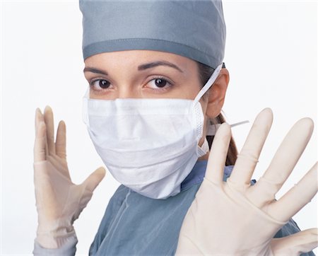 rubber hand gloves - Portrait of Female Surgeon Wearing Rubber Gloves Stock Photo - Rights-Managed, Code: 700-00058313