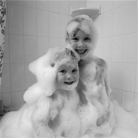 sisters bathing - Portrait of Children in Bathtub Covered in Bubbles Stock Photo - Rights-Managed, Code: 700-00058344