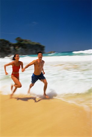 Couple in Swimwear, Running on Beach Dominican Republic, Caribbean Foto de stock - Con derechos protegidos, Código: 700-00058399