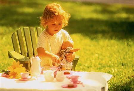 Young Girl Having Tea Party Outdoors Stock Photo - Rights-Managed, Code: 700-00058441