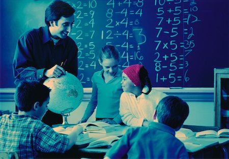 Male Teacher Helping Students in Classroom Stock Photo - Rights-Managed, Code: 700-00058451