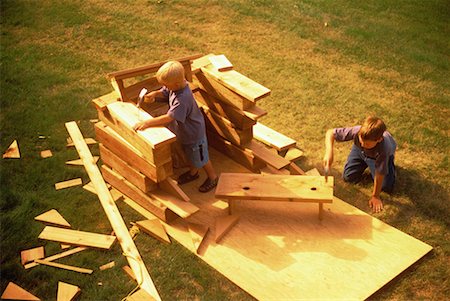 Two Boys Building Wooden Fort Outdoors Stock Photo - Rights-Managed, Code: 700-00058525