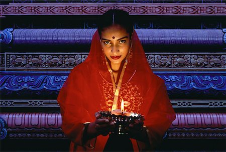 simsearch:700-00085984,k - Portrait of Woman Holding Oil Lamp in Temple, Singapore Stock Photo - Rights-Managed, Code: 700-00058585