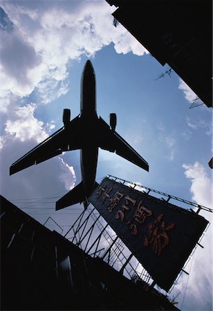 Looking Up at Plane and Sign, Kowloon, Hong Kong Stock Photo - Rights-Managed, Code: 700-00058597