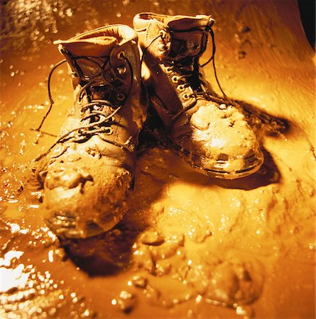 dirty worn shoes - Work Boots Covered in Mud Stock Photo - Rights-Managed, Code: 700-00058781