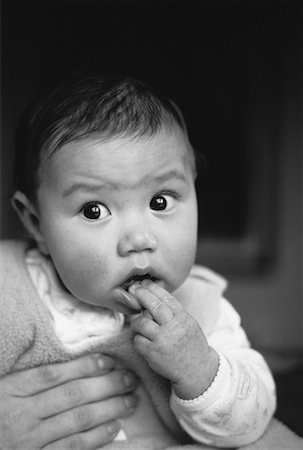 shocked faces in black and white - Portrait of Baby with Fingers in Mouth Stock Photo - Rights-Managed, Code: 700-00058924