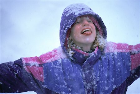 sticking out tongue in snow - Girl Catching Snowflakes on Tongue Stock Photo - Rights-Managed, Code: 700-00058941