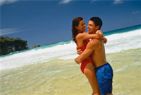 Couple in Swimwear, Embracing on Beach Dominican Republic, Caribbean Foto de stock - Con derechos protegidos, Código: 700-00058975