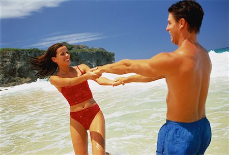 Couple in Swimwear, Holding Hands On Beach Dominican Republic, Caribbean Foto de stock - Con derechos protegidos, Código: 700-00058976