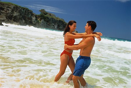 Couple in Swimwear, Embracing in Surf on Beach Dominican Republic, Caribbean Foto de stock - Con derechos protegidos, Código: 700-00058977