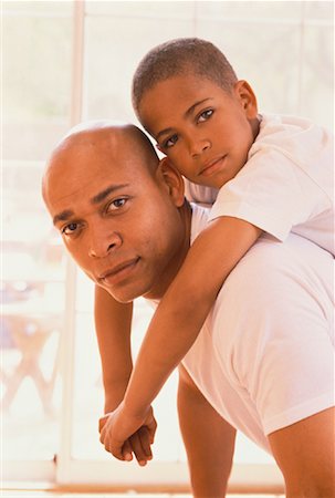 Portrait of Father with Son on Back Stock Photo - Rights-Managed, Code: 700-00059466