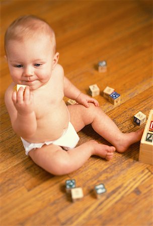 Baby Sitting on Floor with Building Blocks Stock Photo - Rights-Managed, Code: 700-00059595