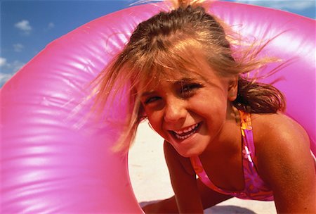 Portrait of Girl in Swimwear on Beach with Inner Tube Miami Beach, Florida, USA Stock Photo - Rights-Managed, Code: 700-00059816