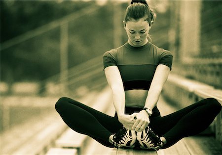 simsearch:700-00086922,k - Woman Sitting on Bleachers Stretching Legs Stock Photo - Rights-Managed, Code: 700-00059874