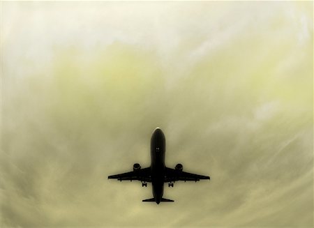 simsearch:700-00551157,k - Silhouette de l'avion dans le ciel Photographie de stock - Rights-Managed, Code: 700-00050005